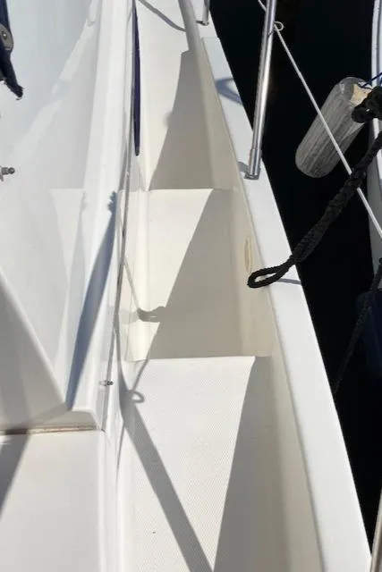 Slide: The Image of 2003 Silverton 35 MY yacht deck with railing and water view. - 19