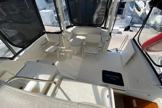 Slide: The Image of 2003 Silverton 35 MY yacht deck with clean white surface and railing. - 20