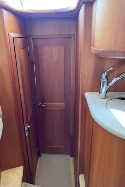 Slide: The Image of 2003 Silverton 35 MY yacht interior with compact fridge and decorative bowl. - 28