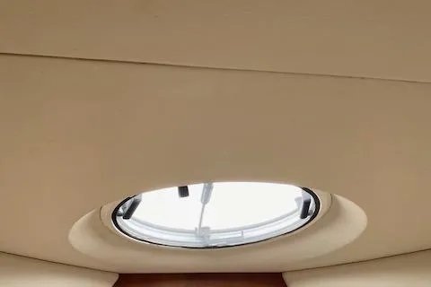 Slide: The Image of 2003 Silverton 35 MY yacht bathroom with wooden cabinetry and compact design. - 35