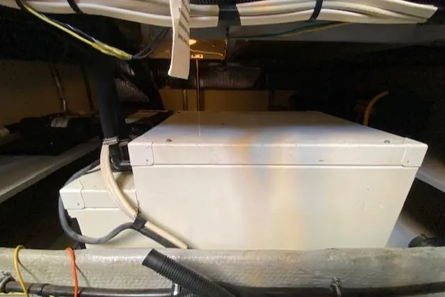 Slide: The Image of 2003 Silverton 35 MY engine compartment with Crusader engine, showcasing mechanical components. - 39