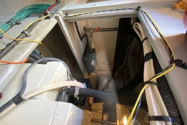 Slide: The Image of Electrical components inside a 2003 Silverton 35 MY boat, featuring organized wiring and cables. - 40