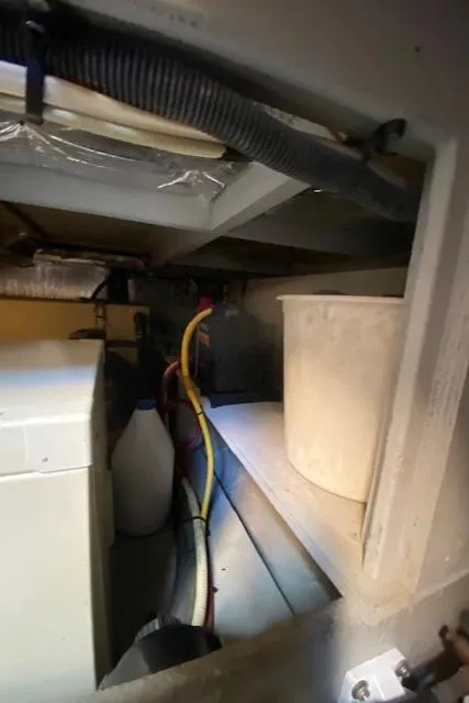 Slide: The Image of Engine compartment of a 2003 Silverton 35 MY boat, showing wiring and hoses. - 41