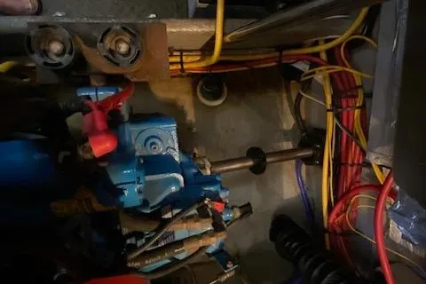 Slide: The Image of 2003 Silverton 35 MY engine room with wiring and storage container. - 42