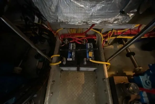 Slide: The Image of Engine compartment of a 2003 Silverton 35 MY with visible wiring and components. - 43