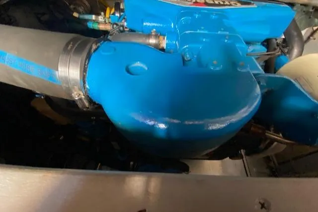 Slide: The Image of 2003 Silverton 35 MY yacht bathroom with wood accents and oval window. - 48