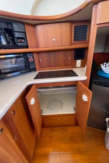 Slide: The Image of Engine component of a 2003 Silverton 35 MY boat, featuring a blue-painted part. - 49