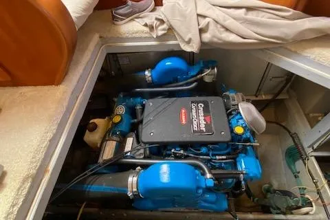 Slide: The Image of 2003 Silverton 35 MY yacht kitchen with wooden cabinets, microwave, and open storage space. - 50