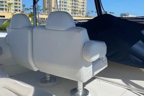 Slide: The Image of 2003 Silverton 35 MY yacht interior with sleek white design and blue accents. - 7