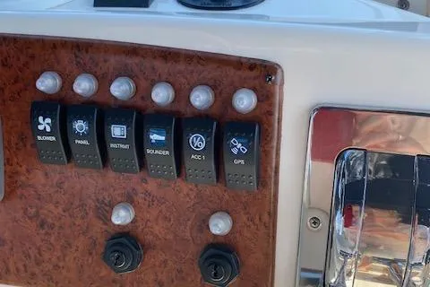 Slide: The Image of 2003 Silverton 35 MY yacht cruising on a serene lake with lush greenery. - 9