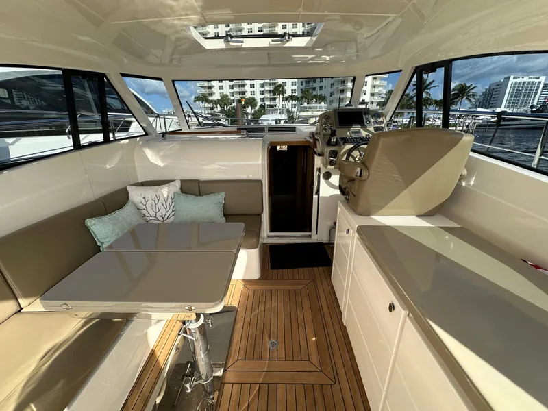 Slide: The Image of Luxurious interior of a 2013 Austin Parker Open 42 yacht with seating and helm. - 11