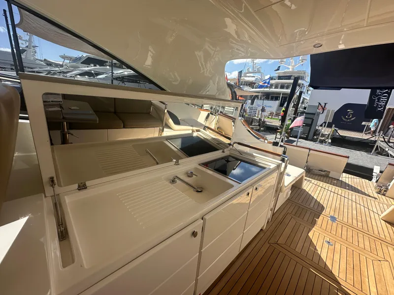 Slide: The Image of Luxurious 2013 Austin Parker Open 42 yacht with sleek outdoor kitchen and teak flooring. - 14