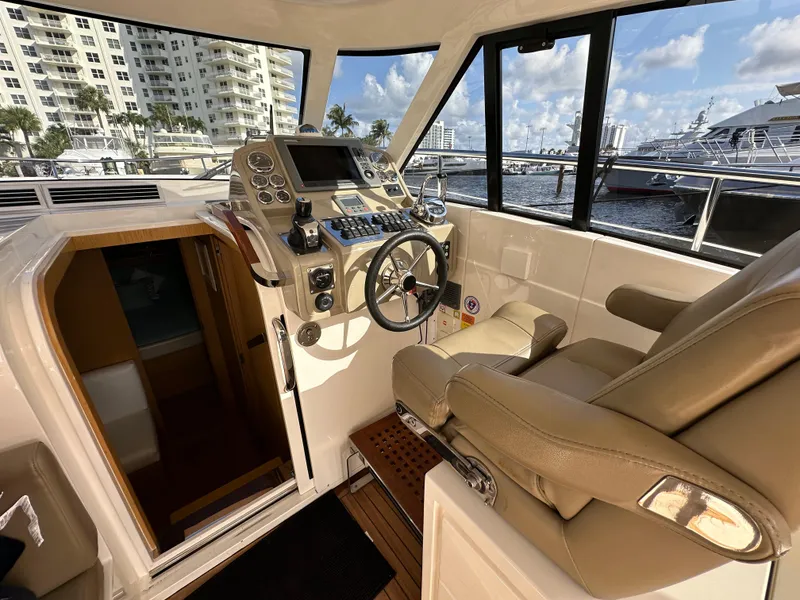 Slide: The Image of Luxurious helm of 2013 Austin Parker Open 42 yacht with modern controls and leather seating. - 15