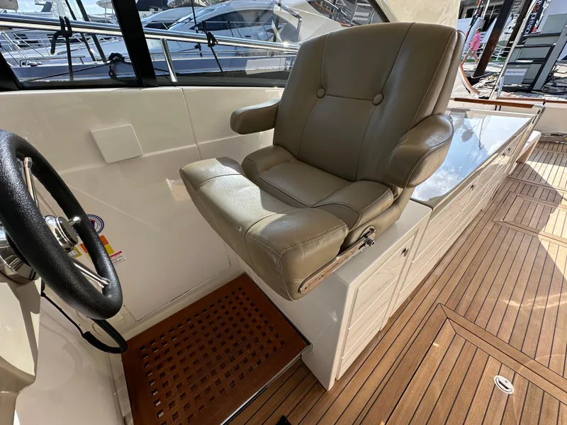 Slide: The Image of Captain's chair on 2013 Austin Parker Open 42 yacht with teak flooring. - 16