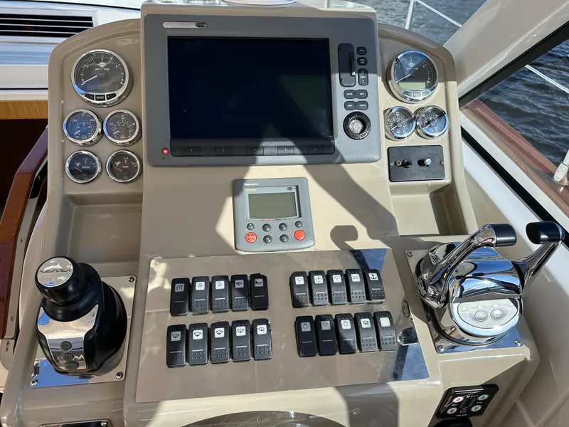 Slide: The Image of Control panel of a 2013 Austin Parker Open 42 yacht with gauges and switches. - 17