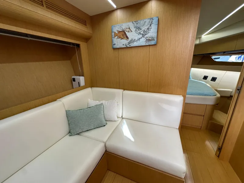Slide: The Image of Luxurious interior of 2013 Austin Parker Open 42 yacht with white seating and wooden accents. - 21
