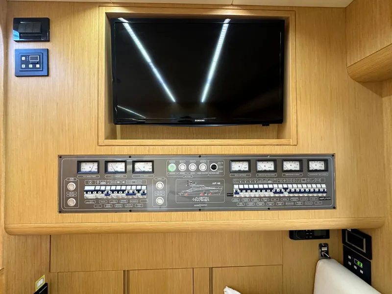 Slide: The Image of Control panel and TV in 2013 Austin Parker Open 42 yacht interior. - 23