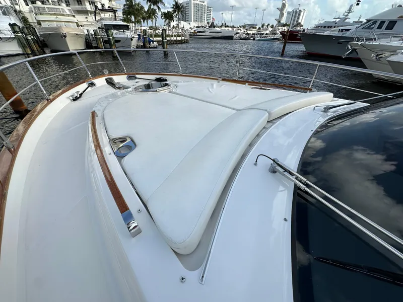Slide: The Image of 2013 Austin Parker Open 42 yacht with sleek deck design in a marina setting. - 29