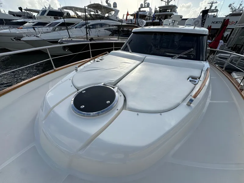 Slide: The Image of 2013 Austin Parker Open 42 yacht docked at marina, showcasing sleek design and spacious deck. - 31