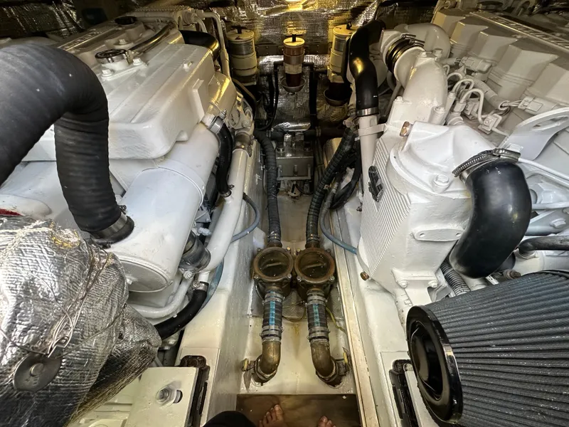 Slide: The Image of Engine room of 2013 Austin Parker Open 42 yacht, showcasing dual engines and mechanical components. - 36
