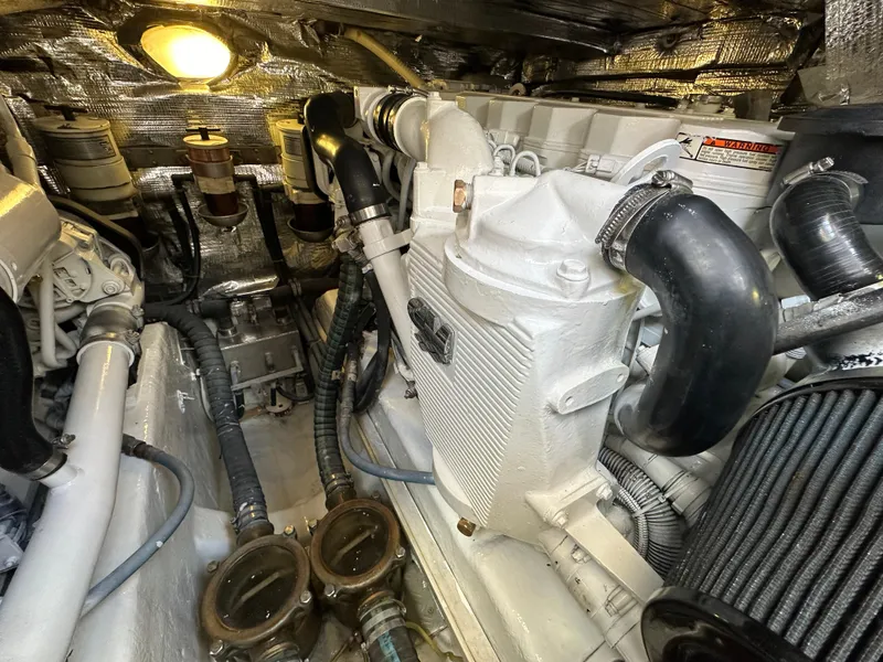 Slide: The Image of Engine room of a 2013 Austin Parker Open 42 yacht, showcasing mechanical components. - 38