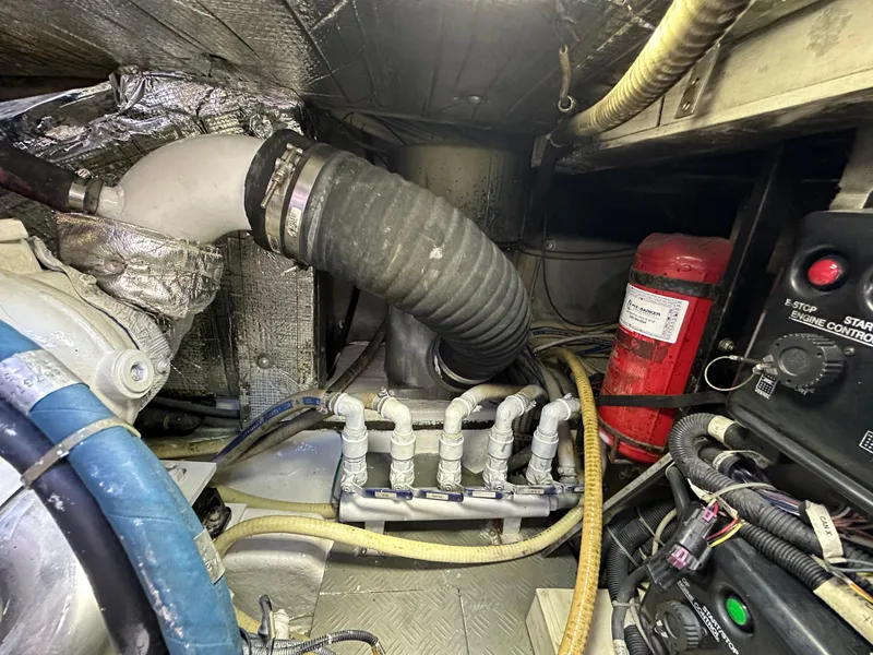 Slide: The Image of Engine room of a 2013 Austin Parker Open 42 yacht, featuring hoses and control panels. - 41