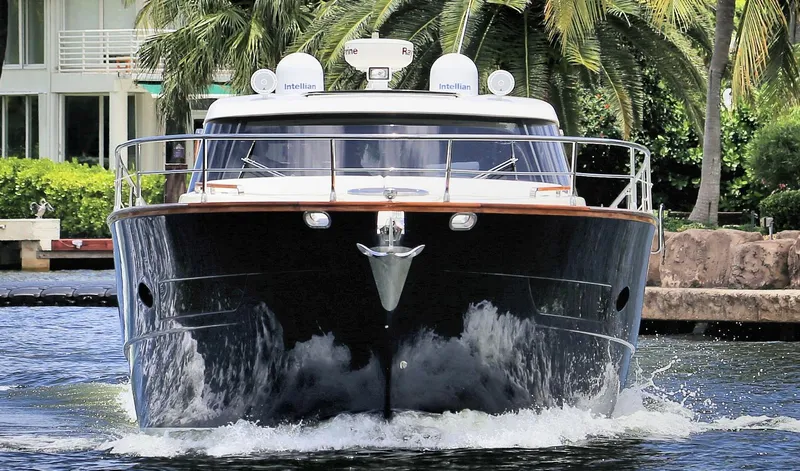 Slide: The Image of Front view of a 2013 Austin Parker Open 42 yacht cruising on water. - 5
