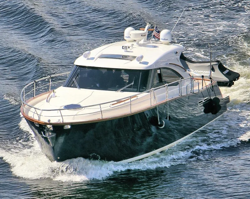 Slide: The Image of 2013 Austin Parker Open 42 yacht cruising on water, showcasing sleek design and modern features. - 7