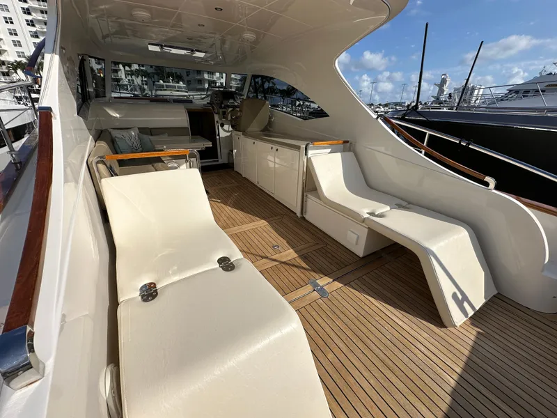 Slide: The Image of Luxurious 2013 Austin Parker Open 42 yacht interior with elegant seating and wooden flooring. - 8