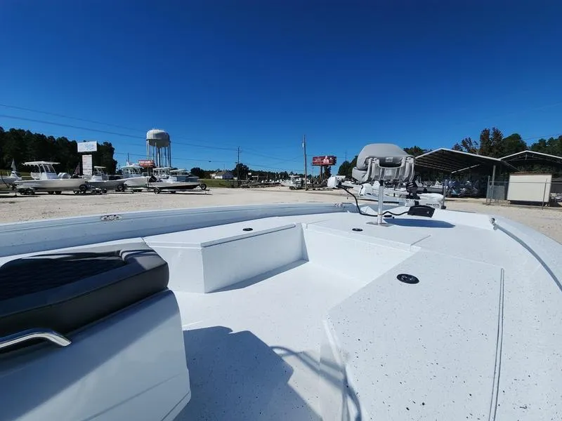 Slide: The Image of 2025 Xpress H22 Bay boat on display under clear blue sky. - 10