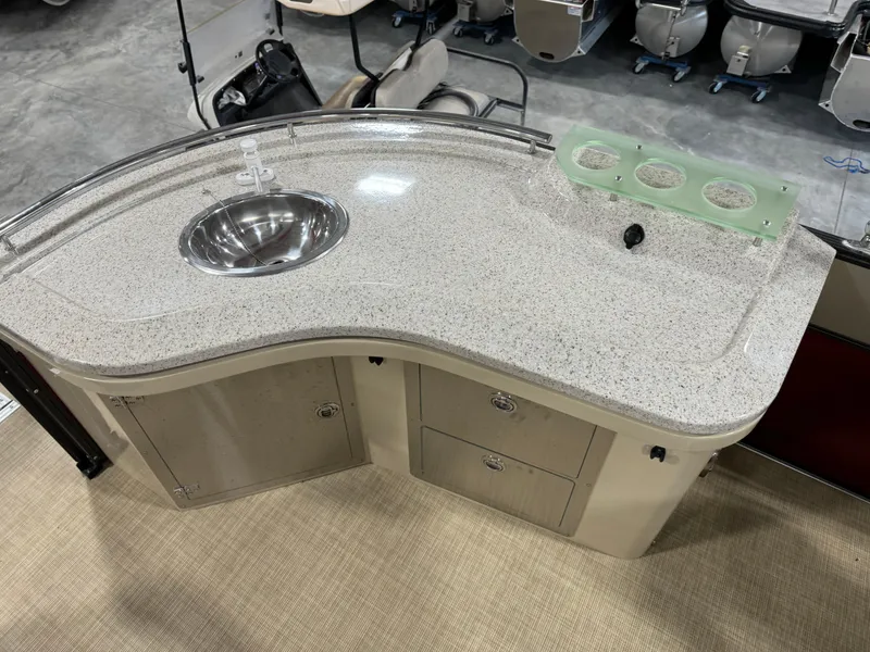 Slide: The Image of 2016 Crest 250 boat interior with a sleek countertop and built-in sink. - 13