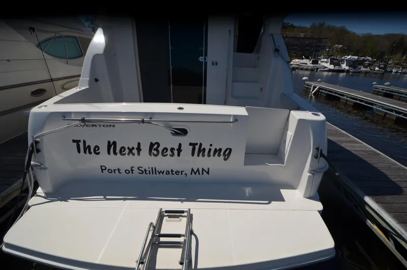 Slide: The Image of 2000 Silverton 330 Sport Bridge docked, named "The Next Best Thing," Port of Stillwater, MN. - 3