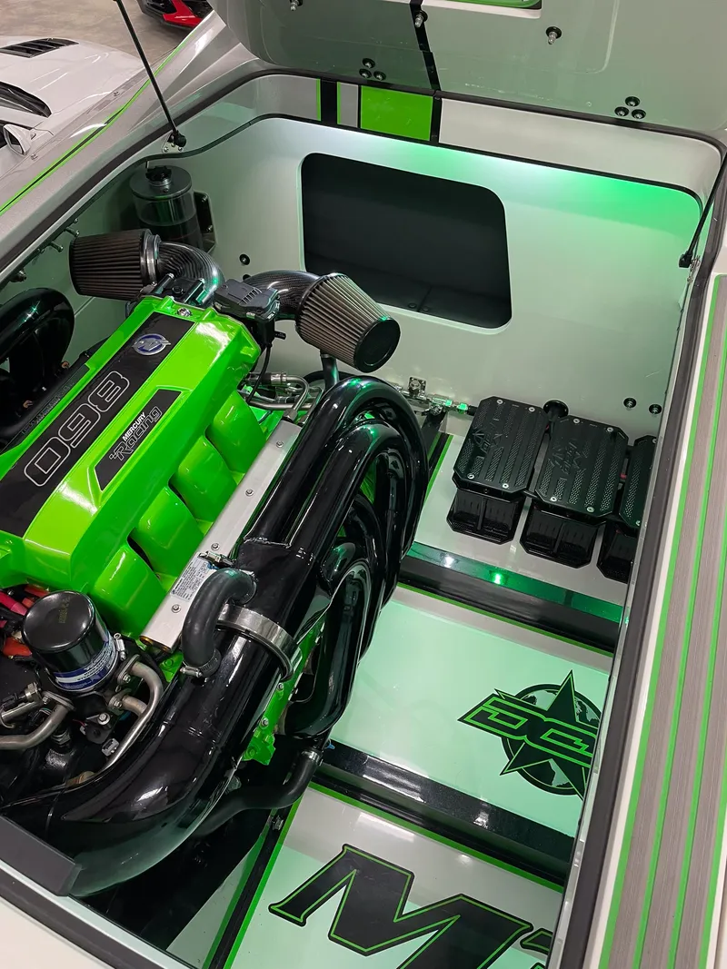 Slide: The Image of 2018 Daves Custom Boats M31 engine compartment with vibrant green accents and sleek design. - 5