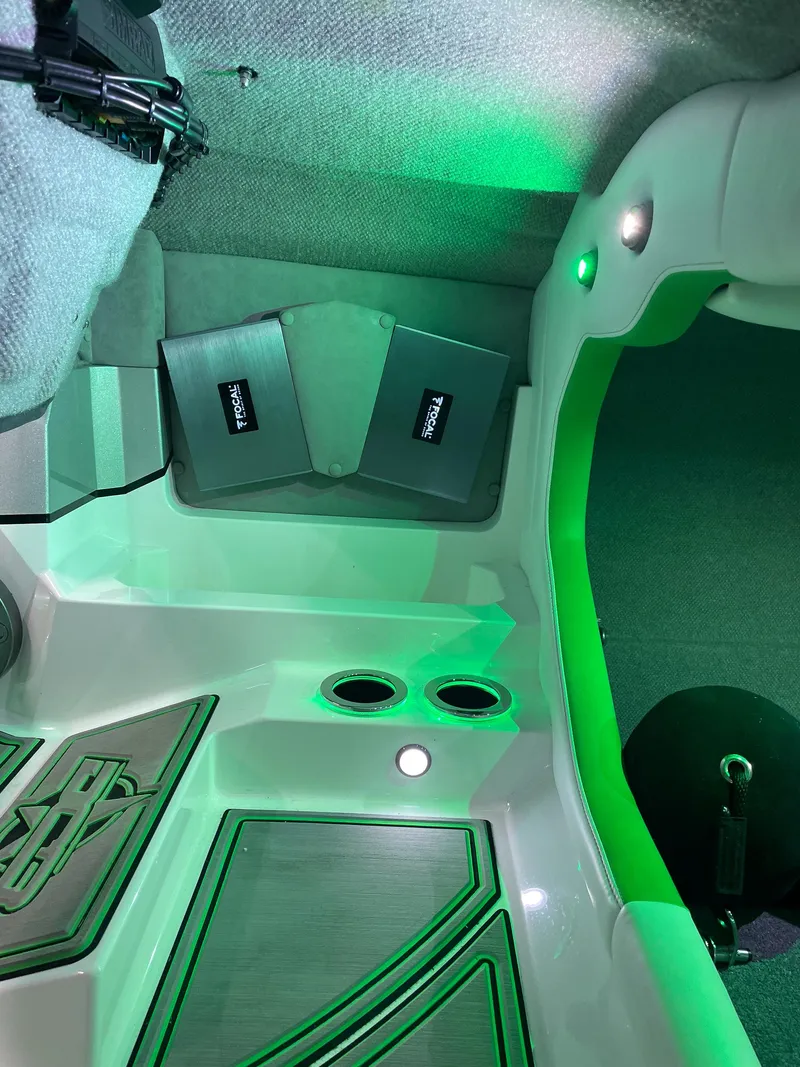 Slide: The Image of 2018 Daves Custom Boats M31 interior with green lighting and modern design elements. - 6