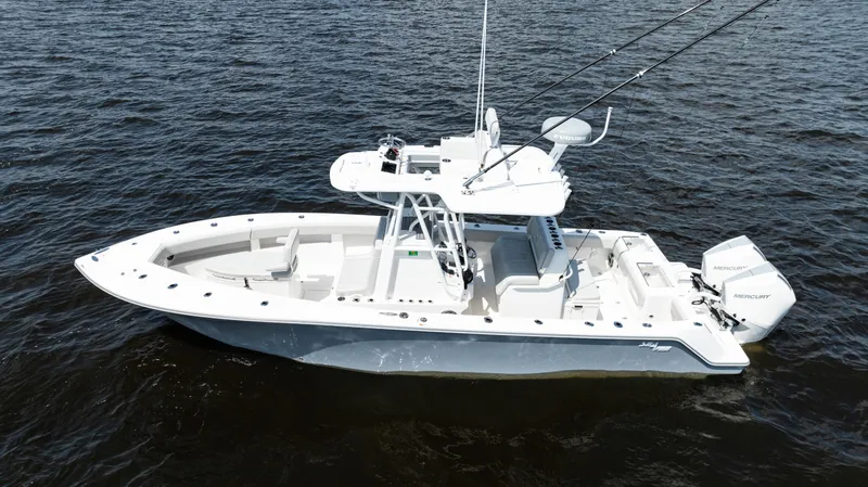 Slide: The Image of 2024 SeaVee 290B boat on open water, featuring dual engines and a sleek design. - 1