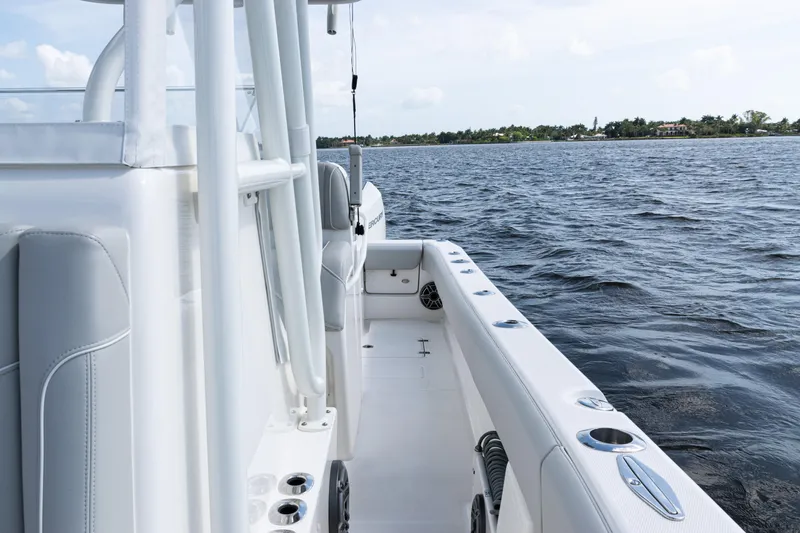 Slide: The Image of 2024 SeaVee 290B boat on water, showcasing sleek design and spacious deck. - 20