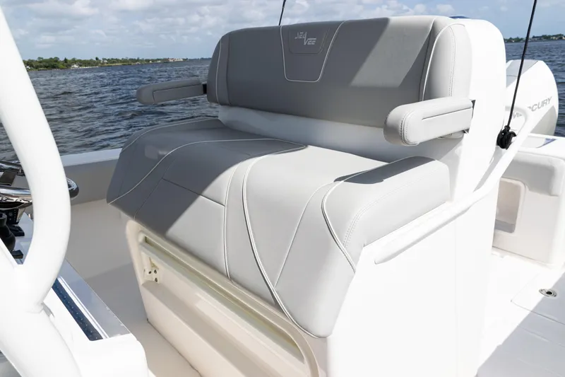 Slide: The Image of 2024 SeaVee 290B boat with comfortable seating, featuring sleek gray upholstery. - 25