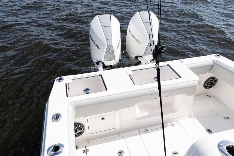 Slide: The Image of 2024 SeaVee 290B boat with dual Mercury outboard engines on the water. - 26