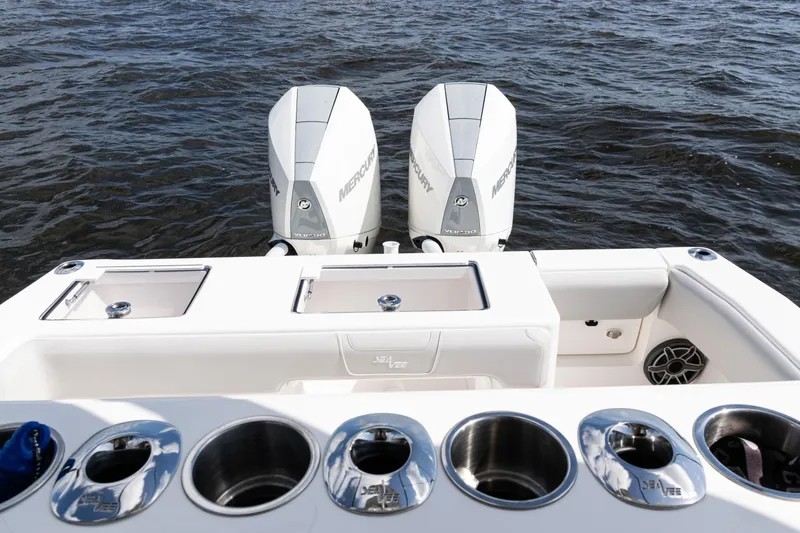 Slide: The Image of 2024 SeaVee 290B boat with dual Mercury engines on open water. - 27