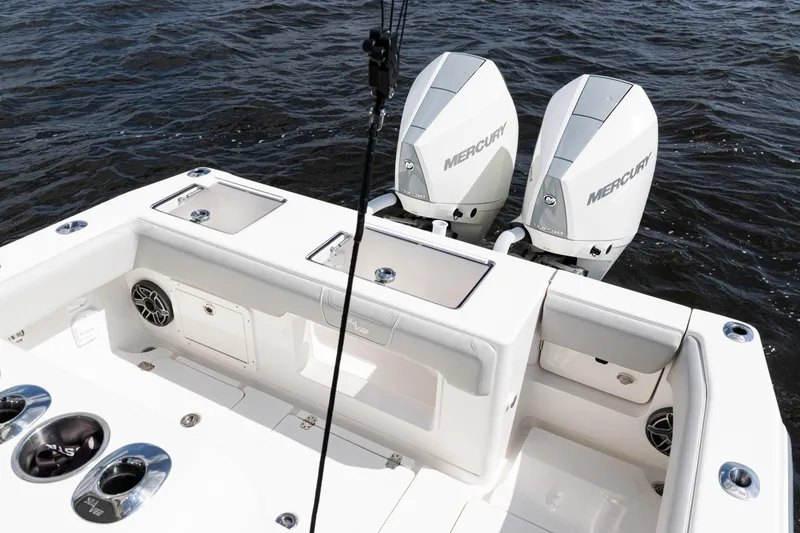 Slide: The Image of 2024 SeaVee 290B boat with dual Mercury engines on open water. - 28