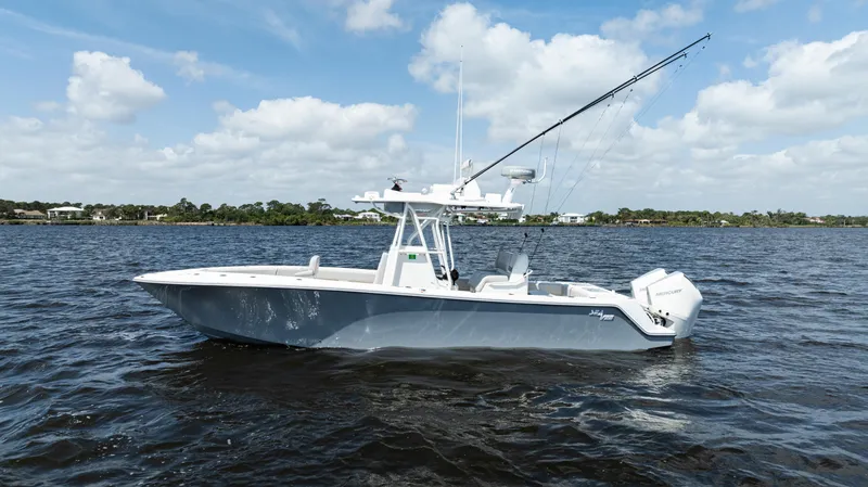 Slide: The Image of 2024 SeaVee 290B boat, aerial view, cruising on dark water. - 3