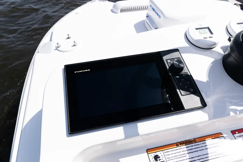 Slide: The Image of 2024 SeaVee 290B boat dashboard with Furuno navigation display. - 37