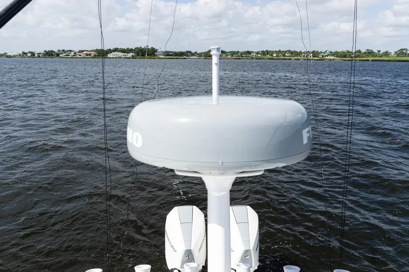 Slide: The Image of 2024 SeaVee 290B boat with radar system on calm water. - 39