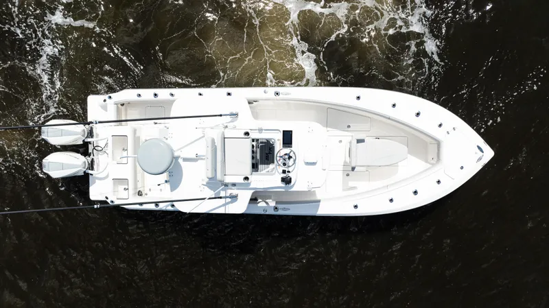 Slide: The Image of Aerial view of 2024 SeaVee 290B boat navigating through dark waters. - 46