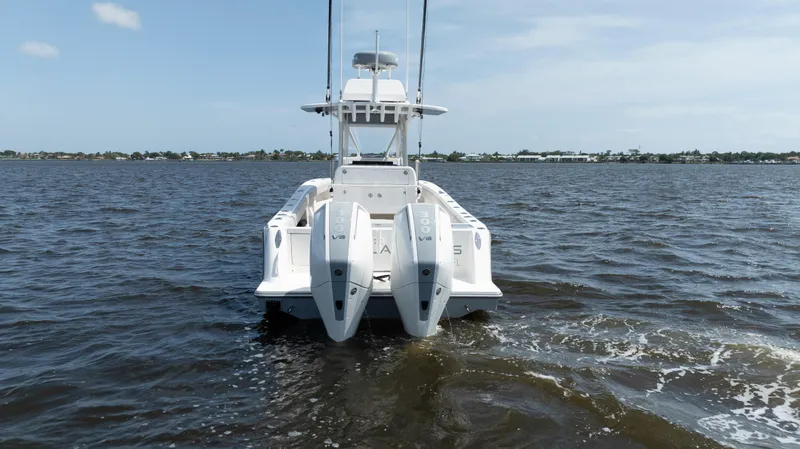 Slide: The Image of 2024 SeaVee 290B boat with dual engines on open water. - 47