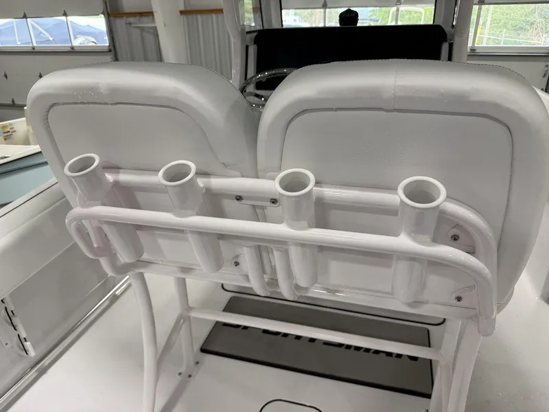Slide: The Image of 2025 Sportsman Open 212 boat seats with integrated rod holders. - 12