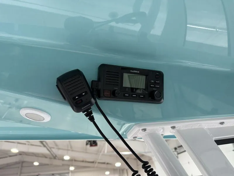 Slide: The Image of 2025 Sportsman Open 212 boat with mounted radio and microphone. - 21