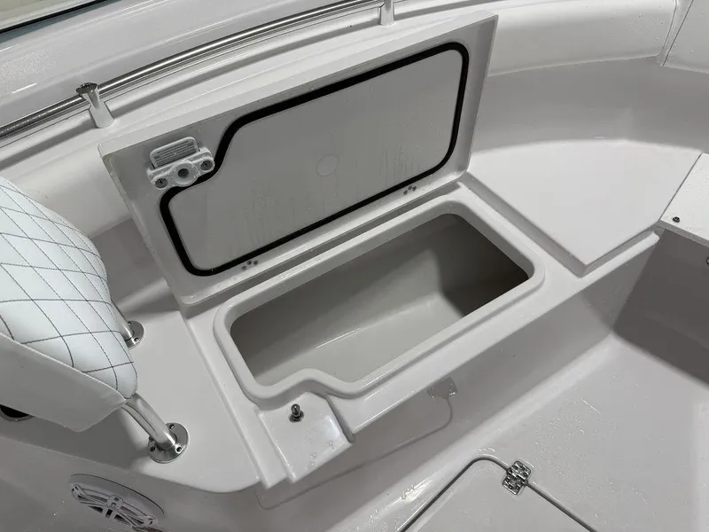 Slide: The Image of 2025 Sportsman Open 212 boat storage compartment with cushioned seating. - 4