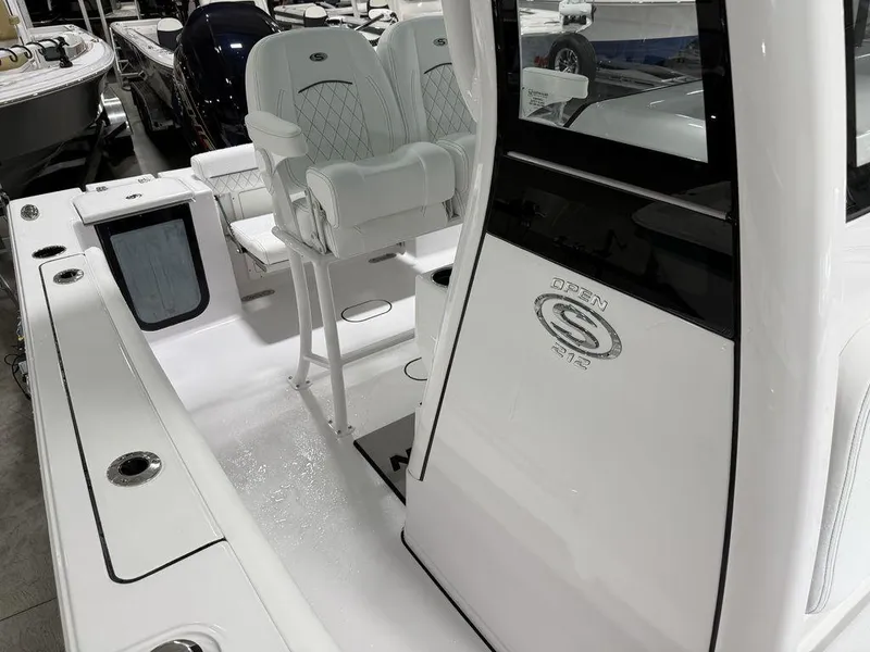 Slide: The Image of 2025 Sportsman Open 212 boat interior with seating and console details. - 7