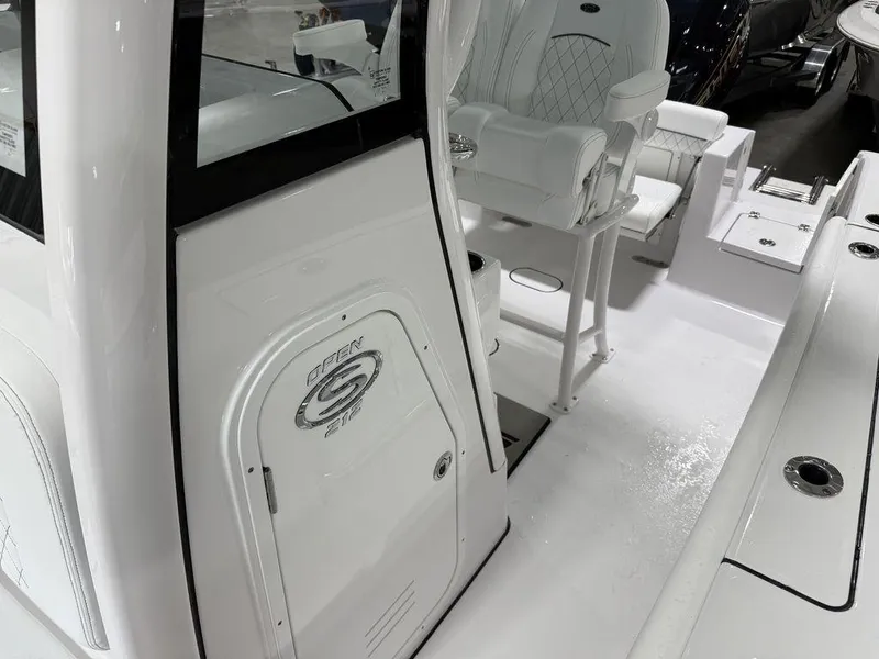 Slide: The Image of 2025 Sportsman Open 212 boat interior with seating and console details. - 9